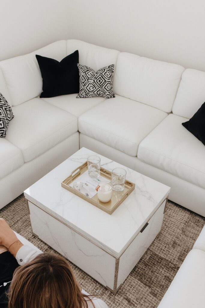 All-White Lounge With Black Accent Pillows
