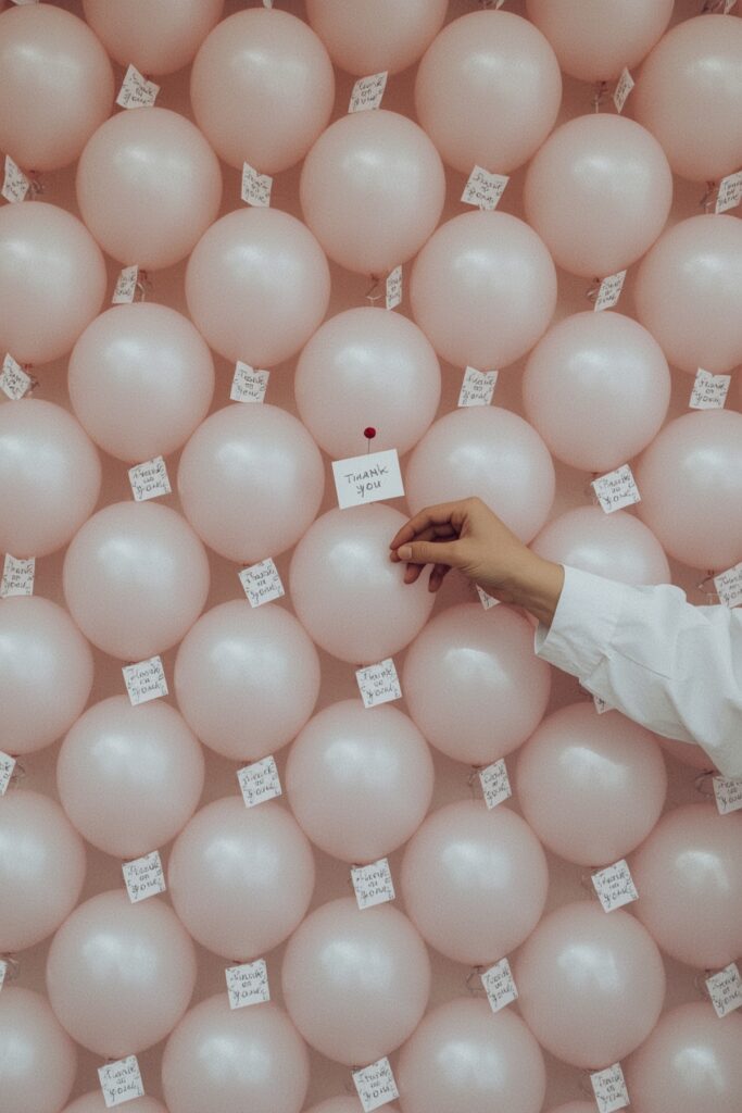 Balloon Thank You Wall for Guests to Pop and Read



