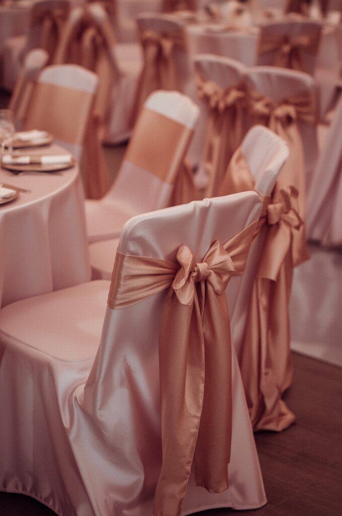 Pink Satin Chair Covers with Gold Bows